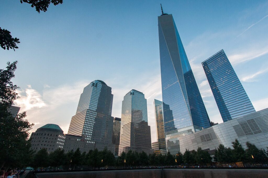 Panoramic view of One World Trade Center and surrounding buildings in New York City.